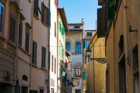Narrow European street with old houses. Florence, Italyの写真素材