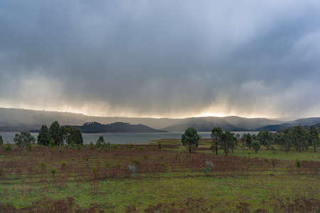 Extreme weather background of heavy rain, storm over rural landscape. Australia