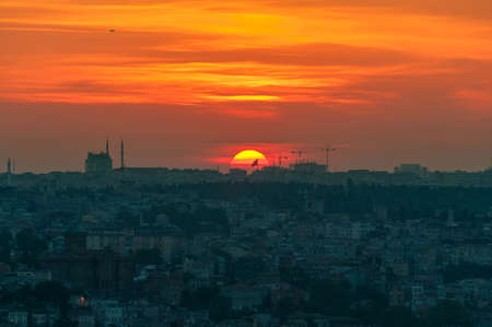 Vivid red orange sky and sun setting Istanbul aerial view. Turkeyの写真素材