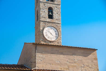 Bell tower with bell and clock with Roman figures. Historic European architectureの写真素材