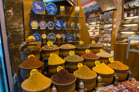 Istanbul, Turkey - August 27, 2013: Spice shop with assortment of different spices in a clay pots....