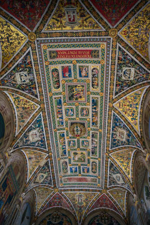 Siena, Italy - September 23, 2013: Piccolomini Library ceiling frescoes by the Umbrian Bernardino di...