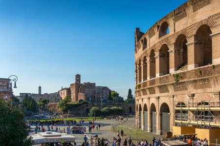 Rome, Italy - September 21, 2013: Cityscape of Rome with tourists near famous Coliseum landmark