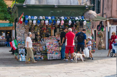 Venice, Italy- September 27, 2013: People near souvenir shop in Venice. Italian tourist industryのeditorial素材