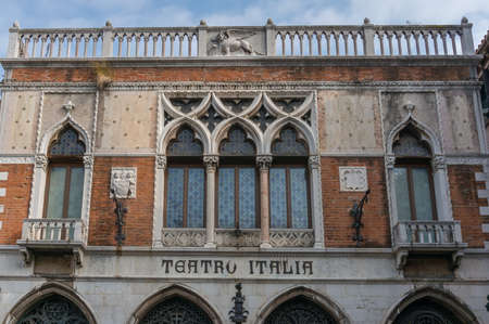 Photo pour Venice, Italy- September 27, 2013: Old historic building with letters Teatro Italia, Italian theatre on facade - image libre de droit