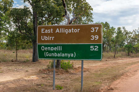 Northern Territory, Australia - June 3, 2019: Road sign with directions to tourist destinations at Kakadu National Park in Australia. Direction to Ubirr, Oenpelli and East Alligator riverのeditorial素材