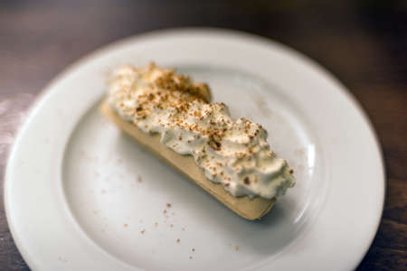 Rakvic, Little Coffin cake on a plate. Traditional Czech dessert cake with creamの写真素材