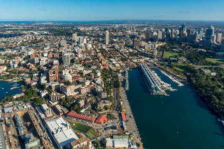 Aerial view of Sydney Business District and suburbs with Woolloomooloo wharf. Modern city view from above with lagoon. Urban aerial photo panoramaの写真素材