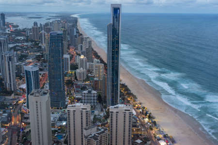 Aerial cityscape of futuristic smart city with skysrapers and tall office buildings along the ocean coastline. Gold Coast, Australiaの写真素材