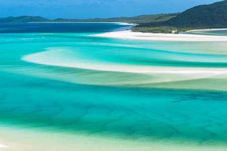 tropical summer beach nature background. Summer seaside vacation landscape with white sand and turquoise blue water. Tropical beach paradise. Queensland, Australiaの写真素材
