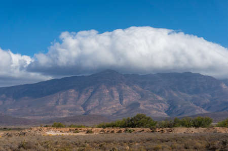 Mountain countryside landscape with dry grass. Drought in countryside. South Africaの写真素材