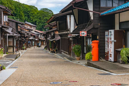 Narai, Japan - September 6, 2016: Narai town street with wooden houses and red post boxのeditorial素材