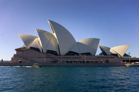Sydney, Australia - July 23, 2016: Profile view of Sydney Opera House building at clear day. Sydney iconic landmark silhouette with waterviewのeditorial素材