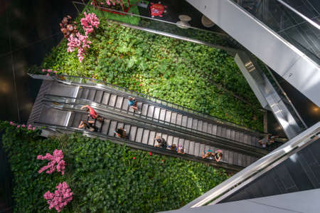 Sydney, Australia - January 26, 2020: People on escalator inside One Central Park Sydney Shopping...