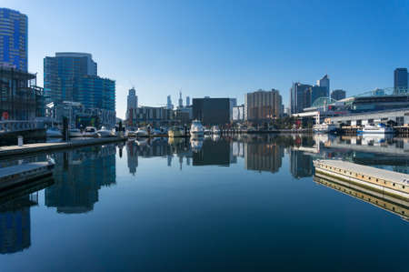 Melbourne, Australia - June 14, 2017: Melbourne Docklands cityscape with pier, wharfs and commercial buildingsのeditorial素材