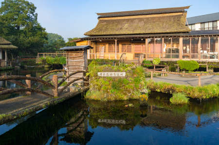 Yamanashi, Japan - August 30, 2016: Traditional Japanese farm house in Oshino Hakkai village. Oshino Hakkai is a touristy set of eight ponds in Oshino, a small village in the Fuji Five Lake regionのeditorial素材
