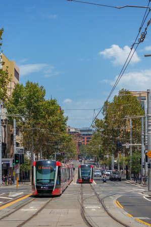 Sydney, Australia - January 26, 2020: Two modern red tramways on George street in Sydney CBD. Public transport infrastructureのeditorial素材