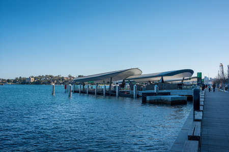 Sydney, Australia - July 23, 2017: Barangaroo wharf, ferry station with people waiting for the ferry. Public transport infrastructure in Sydney, Australiaのeditorial素材