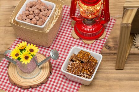 Brazilian June party table decorated with delicious typical sweets. Sugary peanut and crunchy peanut brown sugar.の写真素材