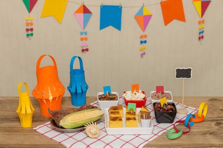 Decorated, colorful and cheerful table with typical sweet and savory foods to celebrate the Brazilian June party. `Festa Junina`.の写真素材