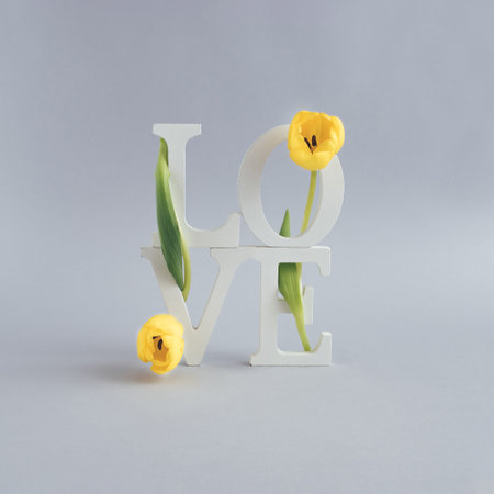 Composition with the letters LOVE and flowers. Nature love concept. Mother's day or Valentines idea.の写真素材