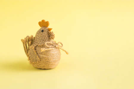 2021 Easter unique concept. Easter chicken made of rope on a yellow background. Holiday and food backgroundの写真素材