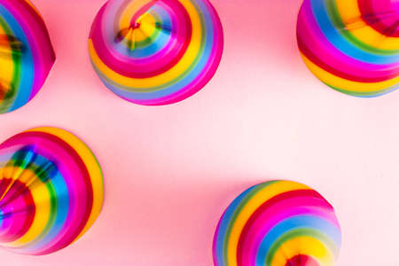 Summer party composition with colorful hats on a pastel pink background. Minimal party concept.の写真素材