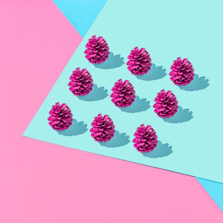 Creative geometric composition with colorful cones on vivid pink and blue background. Autumn fun concept.の写真素材