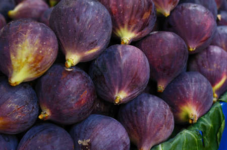 Heap of ripe purple figs at vegetable marketの写真素材