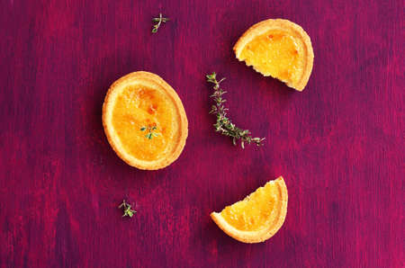 Shortcrust mini tart dessert with lemon and thyme