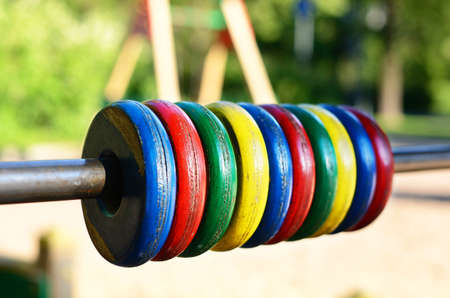 Colorful wooden wheels at children playground, selective focusの写真素材