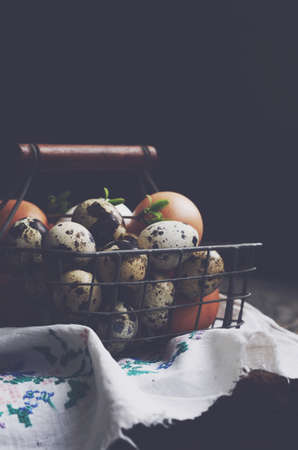 Basket with farmers eggs on dark backgroundの写真素材