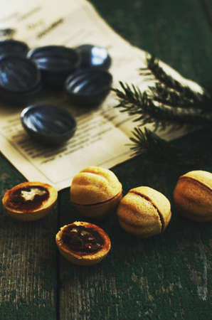 Homemade sweets with caramel and nuts for Christmas on green backgroundの写真素材