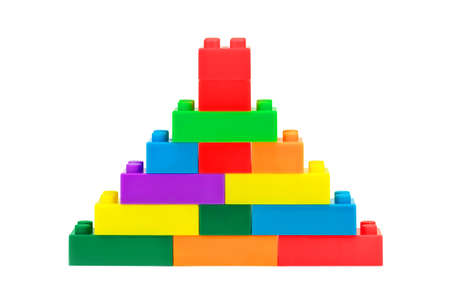 Tower made from plastic toy blocks on white backgroundの写真素材