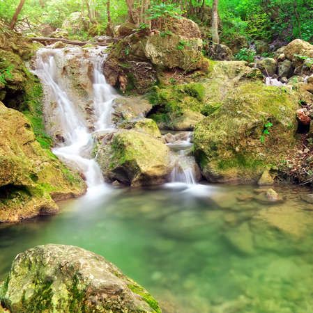 Waterfall. Mountain river. Spring wood and river. の写真素材