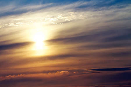 Beautiful sunset sky with sun. Sky background.の写真素材