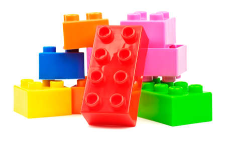 Toy colorful plastic blocks isolated on white background