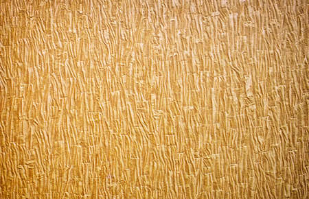 Gold background texture. Wallpaper on the wall. Element of design.の写真素材