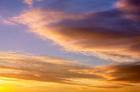 Fiery orange sunset sky. Beautiful sky. Clouds in motion in the sky during sunsetの写真素材