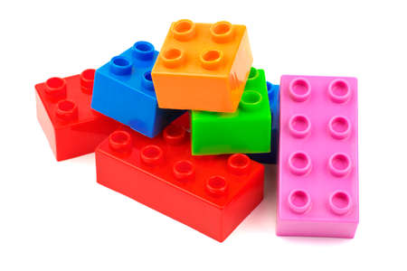 Toy colorful plastic blocks isolated on white の写真素材