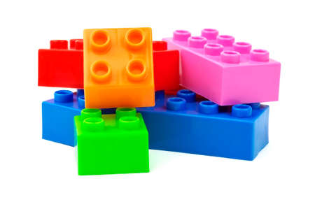 Toy colorful plastic blocks isolated on white の写真素材