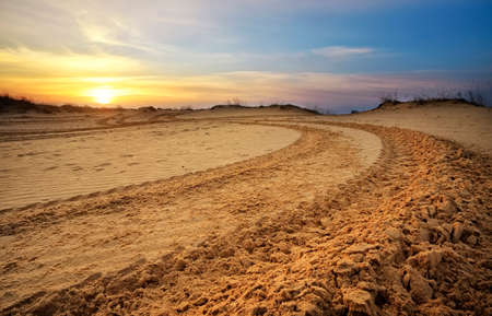 Motocross and auto sport track with sunset sky background. の写真素材