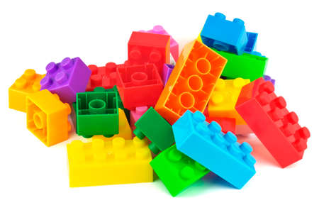 Toy colorful plastic blocks isolated on white backgroundの写真素材