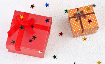 Colorful christmas gifts wits stars in snowの写真素材