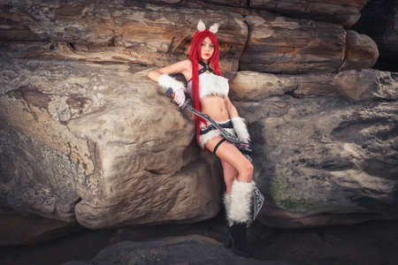 Beautiful female character with two swords in mountain area.の写真素材