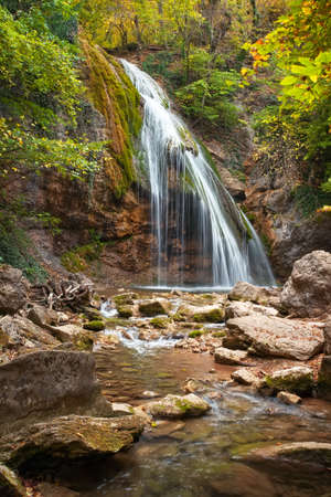 Beautiful autumn landscape with waterfall Dzur-Dzur in Crimeaの写真素材