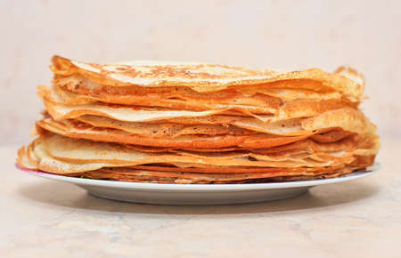 Many pancakes on the plate closeup. Maslenitsa Festivalの写真素材