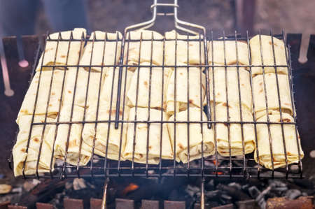 Freshly pancakes with filling, roasted on the grill.の写真素材