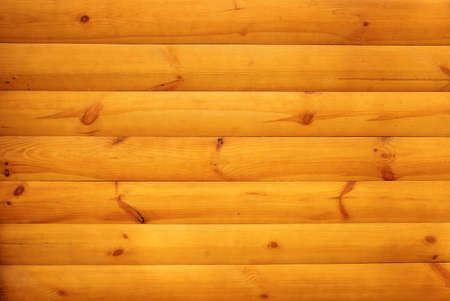 Orange wooden slats with knots joined together. Wooden texture backgroundの写真素材