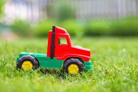 The toy truck car on green meadow.の写真素材